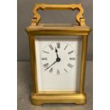 An 20th century brass cased carriage clock with enamel dial