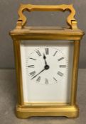 An 20th century brass cased carriage clock with enamel dial
