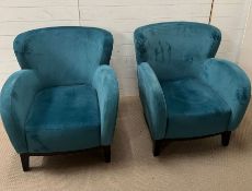 Two teal tub chairs