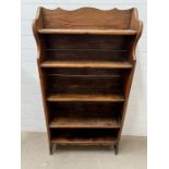 An oak five tier open bookcase (H147cm W76cm D23cm)