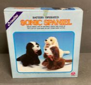 A Sonic Spaniel boxed toy and a clown puppet