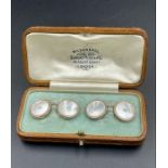 A pair of mother of pearl gents cuff links