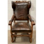 A 17th/18th Century Swedish Baroque leather covered wingback chair
