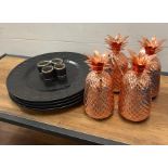 Four copper cocktail pineapple glasses along with four place matts and napkin rings