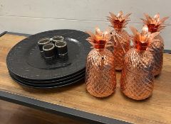 Four copper cocktail pineapple glasses along with four place matts and napkin rings