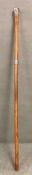 A walking stick/cane with white metal top and silver Birmingham hall marked, markers mark BS