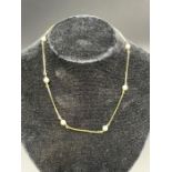 An 18ct pearl and gold necklace (6.2g approximate total weight)