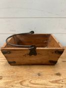 A small wooden crate with metal handles