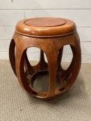 A cherrywood oriental barrel stool