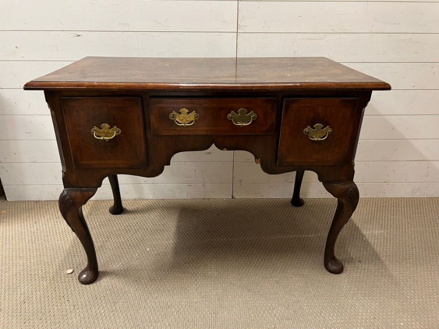 Chippendale style walnut dressing table, rectangular top over hanging three drawers on cabriole legs