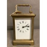 An 20th Century brass cased carriage clock with enamel dial