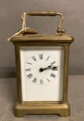 An 20th Century brass cased carriage clock with enamel dial