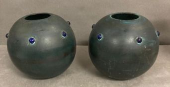 A Pair of Ovoid Copper vases with blue cabochons.