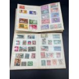 Two small stock books of Worldwide stamps, various ages and denominations