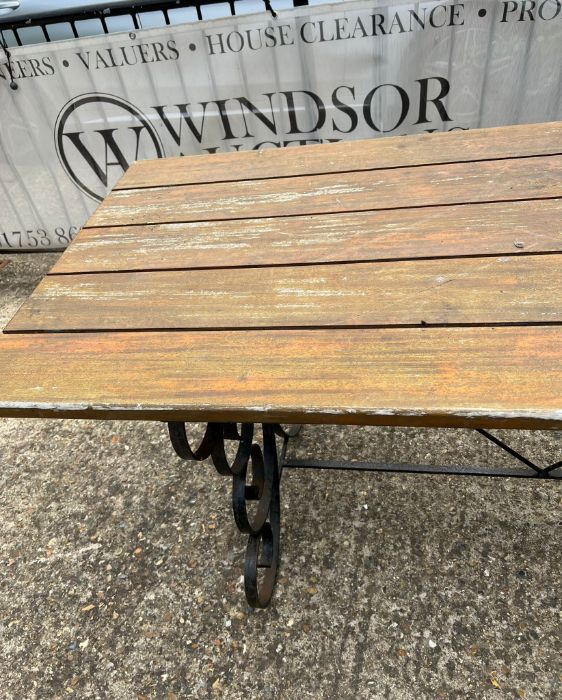 A wrought iron plank top garden table with scrolling sides (H76cm W183cm D76cm) - Image 2 of 3