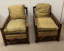 A Victorian salon suite, two gentleman armchairs with scrolling carved fronts and spindled arm