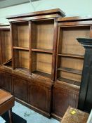A George III style mahogany breakfront libairy bookcase/ cabinet with adjustable shelves top and