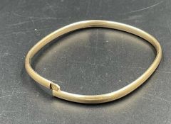 A 9ct gold bangle (Approximate total weight 4.8g)