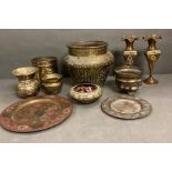 A selection of brass items to include a planter and various pots, bowls and plates