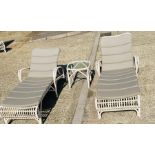 Two off white woven garden sun loungers and one side table by Lucy Collection