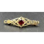 A 9ct gold brooch with central stone (Approximate Weight 2.2g)