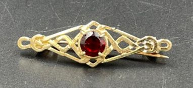 A 9ct gold brooch with central stone (Approximate Weight 2.2g)