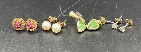 A selection of four pairs of gold earrings in various styles.
