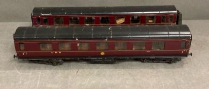 A pair of vintage model railway carriages