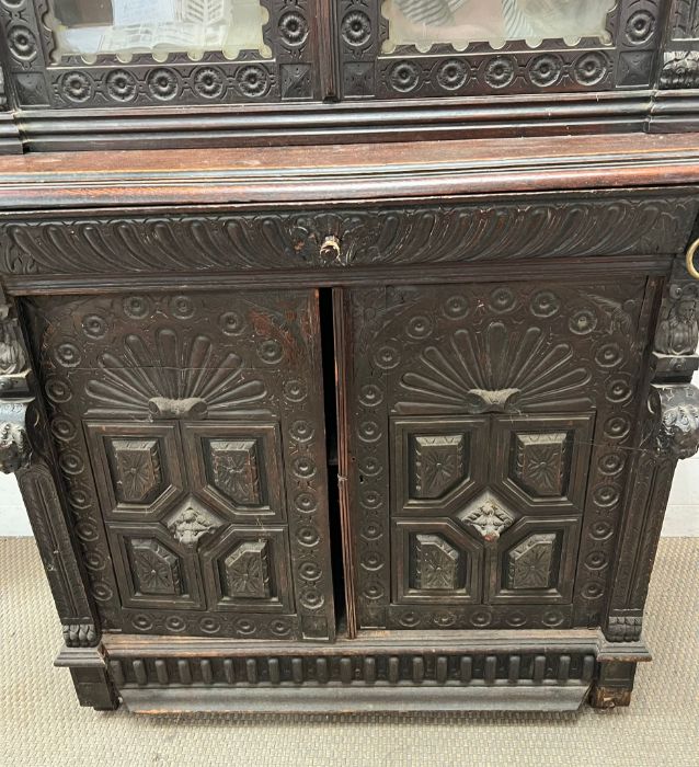 A Gothic inspired glazed bookcase cabinet with carved lion heads to each corner with brass rings and - Image 7 of 10