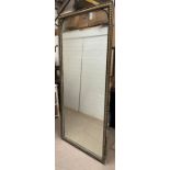 A full length ebony and gilt wall mirror 107cm x 222cm