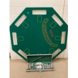 A blackjack gaming table top and a case set of cards, chips and dices