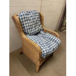 A wicker wing back chair