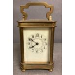 An 20th Century brass cased carriage clock with enamel dial