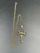 A 9ct gold pendant with central peridot stone and 9ct gold chain (Total Weight 6.1g)