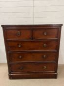A mahogany two over three chest of drawers with brass ring handles (H120cm W114cm D50cm)