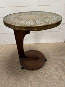 A brass tea table with striking oak stand