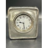 A silver cased Asprey travel clock