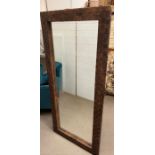 A leather cross banded wall mirror 167cm x 76cm