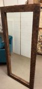 A leather cross banded wall mirror 167cm x 76cm