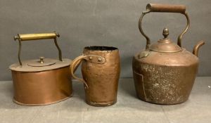 Two copper teapots and a copper beaker