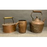 Two copper teapots and a copper beaker
