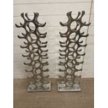 Two contemporary metal wine racks holding Twenty seven bottles each