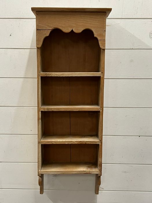 A wall hanging pine shelving unit (H77cm W31cm D10cm)