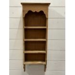 A wall hanging pine shelving unit (H77cm W31cm D10cm)