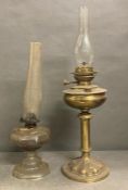 A pair of vintage oil lamps
