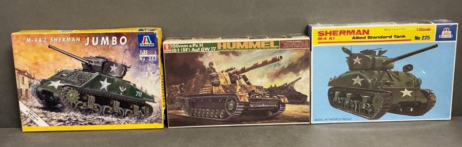 Two Italeri model kits an M-4A2 Sherman Jumbo and a Sherman M4A1 and a Bandai Hummel Auf GWIV 1:35