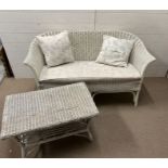 A wicker two seater sofa and coffee table (H77cm W137cm D65cm)