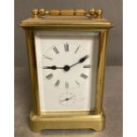 An 20th Century brass cased carriage clock with enamel dial