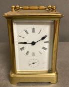 An 20th Century brass cased carriage clock with enamel dial