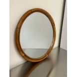 A small cane circular mirror